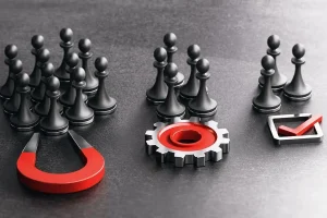 Ein Magnet, der Schachfiguren anzieht, mit einem Zahnrad und einem Häkchensymbol davor.